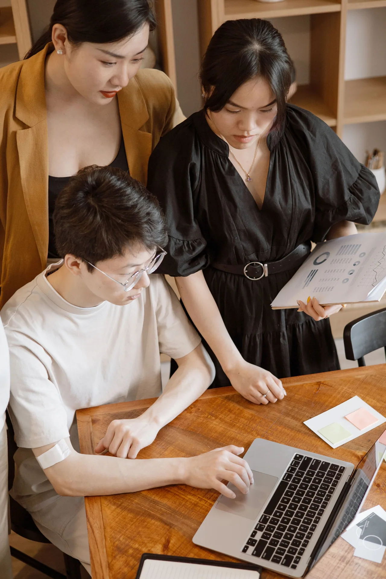 An editorial team reviews different audience and title treatments together